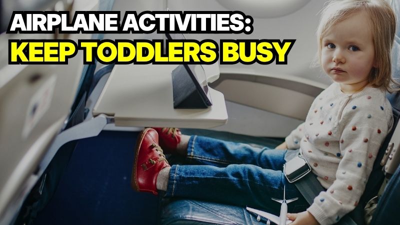 A toddler sitting in an airplane seat, showing how to keep toddlers busy on a plane.