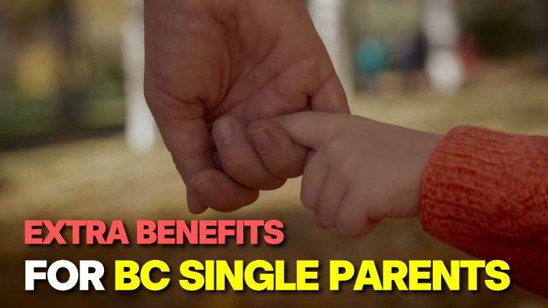 A close-up of an adult's hand gently holding a child's hand, symbolizing the support provided through BC single mom benefits in Canada.