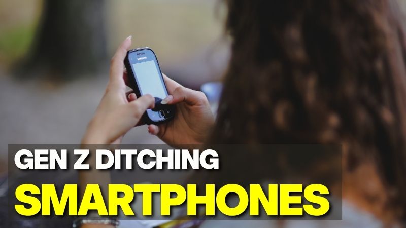 A young person holding a classic feature phone, illustrating how Gen Z ditching smartphones for an analog lifestyle.